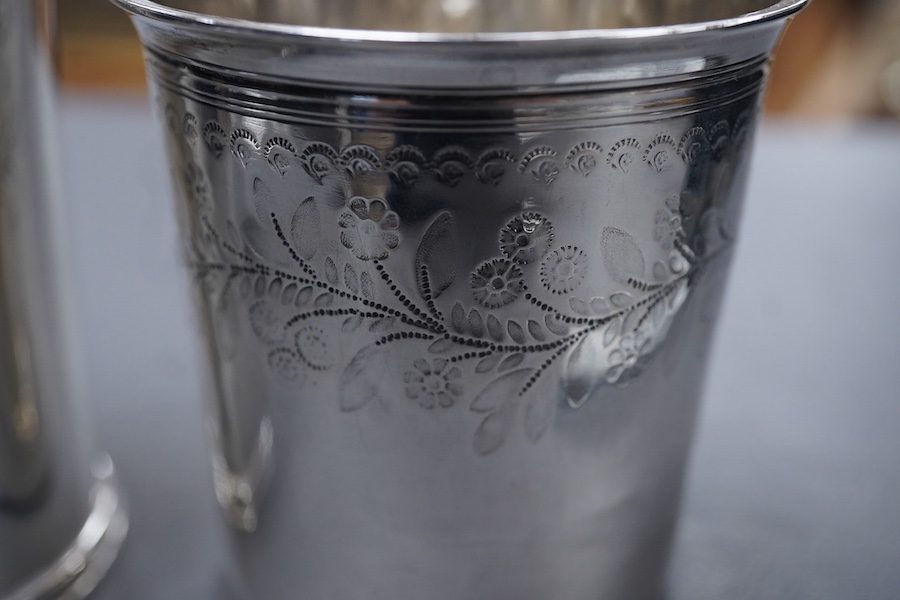 An Elizabeth II silver beaker, with engraved initials, makers TW over BD, London, 1992, 87mm, together with a 1920's hammered Danish white metal beaker and a 19th century French 950 standard white meal beaker, 9.8oz.